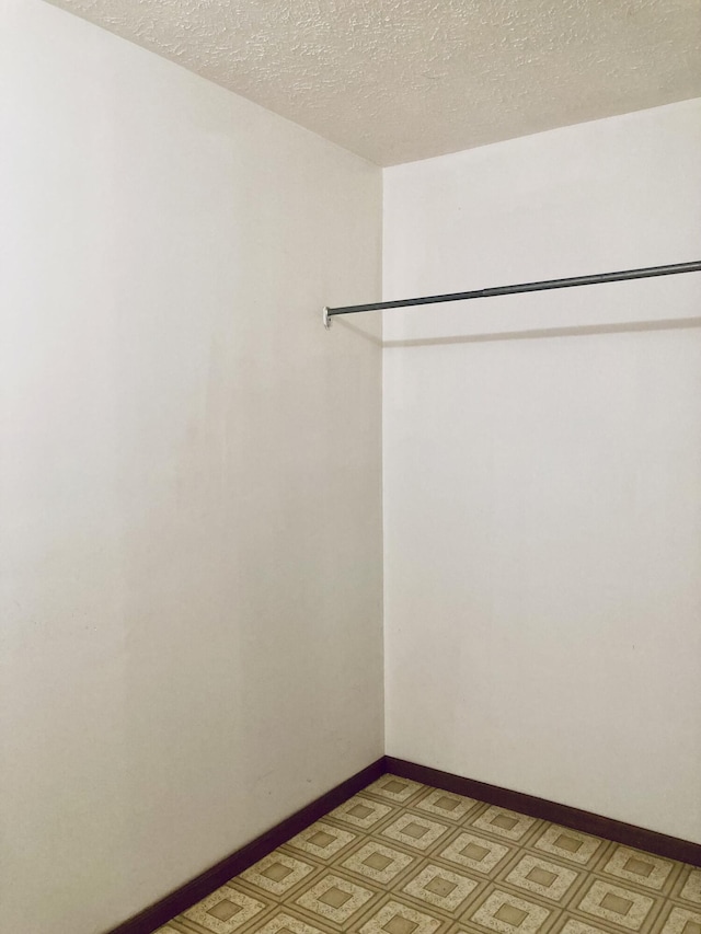1184 Snow Creek Rd, Clay City, KY 40312 - unfurnished room with light floors, a textured ceiling, and baseboards
