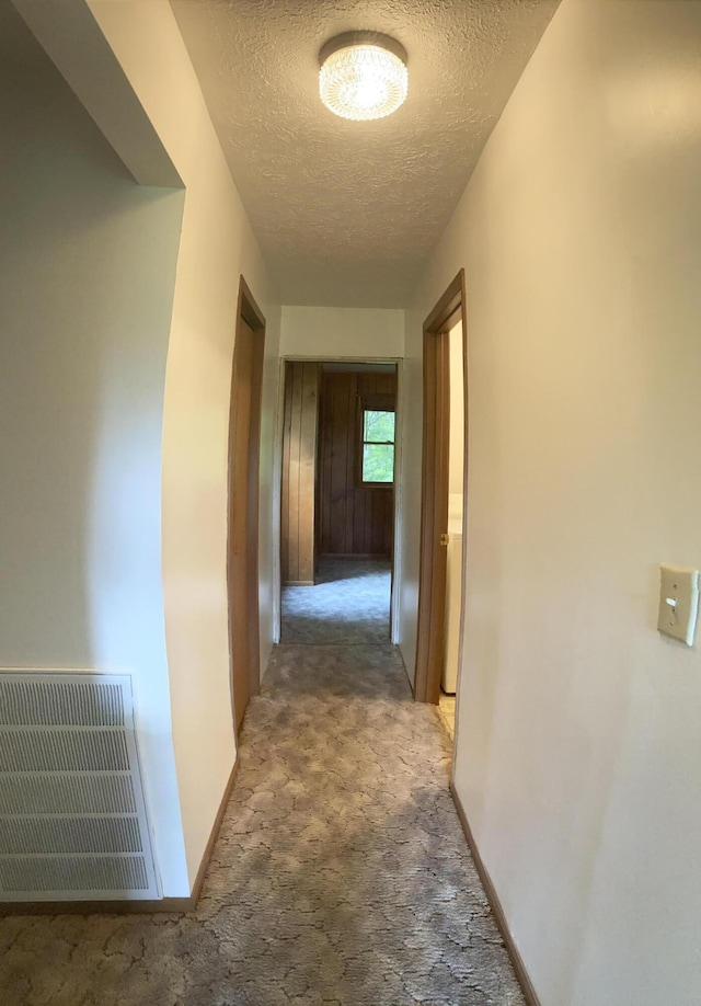 1184 Snow Creek Rd, Clay City, KY 40312 - hallway with a textured ceiling, light carpet, and baseboards