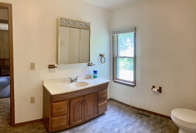 1184 Snow Creek Rd, Clay City, KY 40312 - bathroom featuring vanity, healthy amount of natural light, toilet, and baseboards