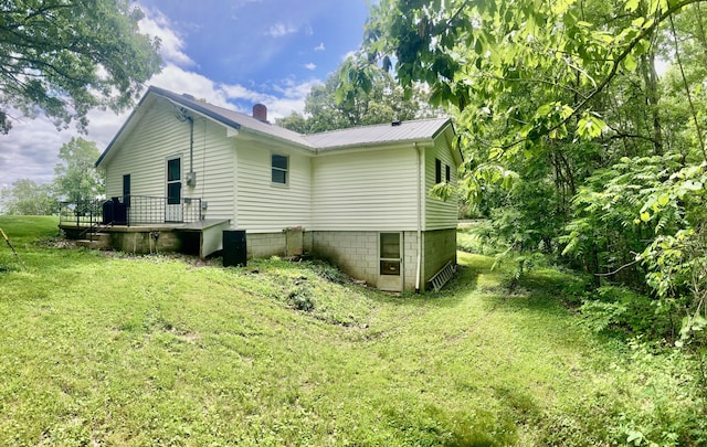 1184 Snow Creek Rd, Clay City, KY 40312 - view of side of property featuring a chimney, a yard, and metal roof