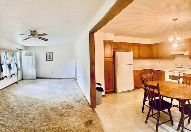 1184 Snow Creek Rd, Clay City, KY 40312 - kitchen featuring white appliances, under cabinet range hood, ceiling fan, brown cabinets, and decorative light fixtures