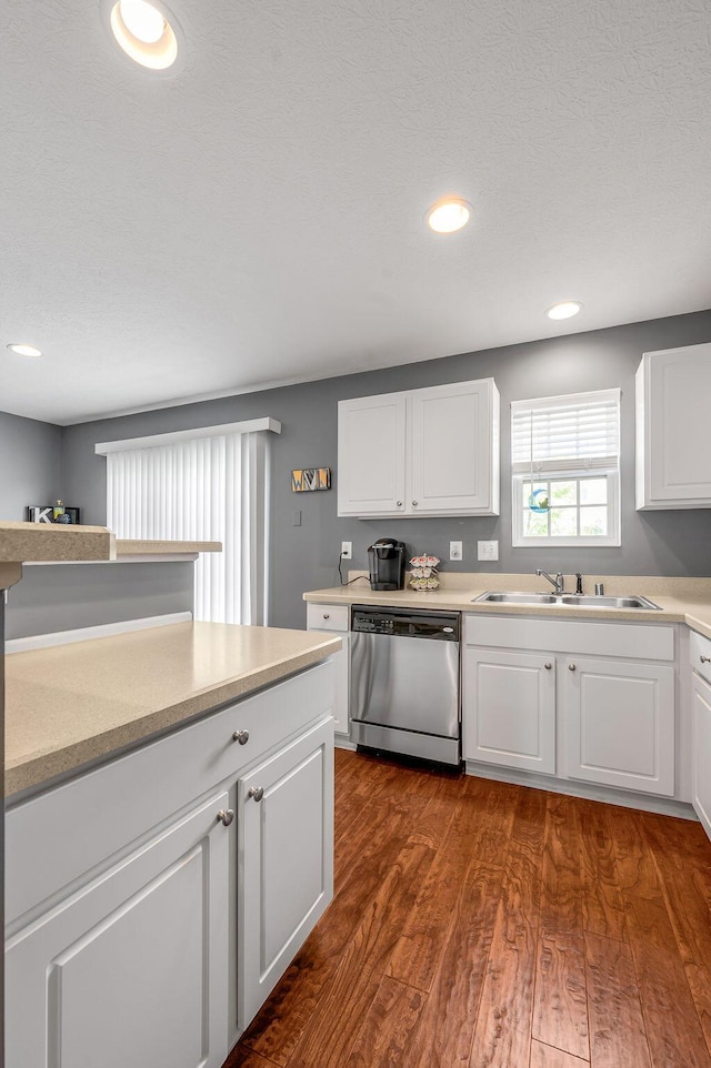 2433 Aristocracy Cir, Lexington, KY 40509 - kitchen with stainless steel dishwasher, a sink, dark wood finished floors, light countertops, and white cabinetry