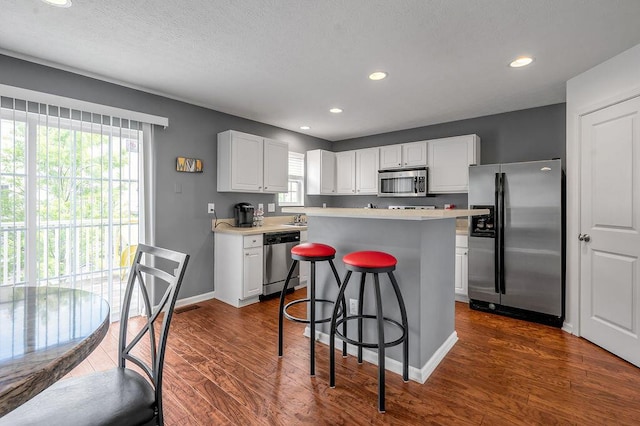 2433 Aristocracy Cir, Lexington, KY 40509 - kitchen with appliances with stainless steel finishes, healthy amount of natural light, white cabinetry, light countertops, and recessed lighting