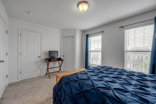 2433 Aristocracy Cir, Lexington, KY 40509 - bedroom with light carpet, a textured ceiling, and baseboards