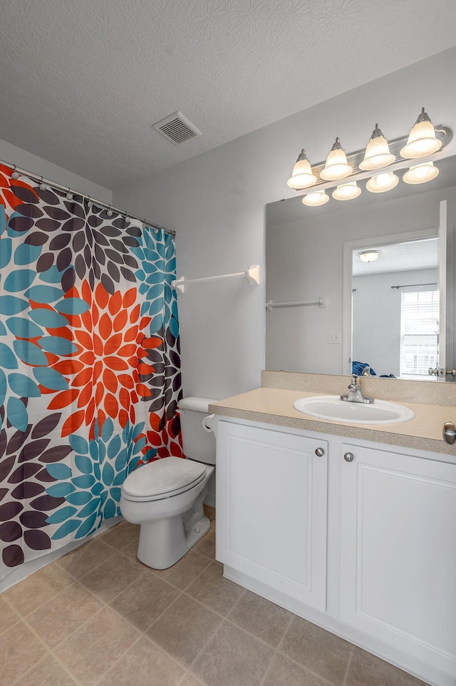2433 Aristocracy Cir, Lexington, KY 40509 - full bath with toilet, vanity, and a textured ceiling