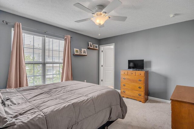 2433 Aristocracy Cir, Lexington, KY 40509 - bedroom featuring carpet floors, a textured ceiling, baseboards, and ceiling fan