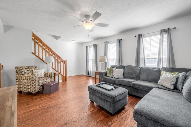 2433 Aristocracy Cir, Lexington, KY 40509 - living area featuring wood finished floors, a ceiling fan, stairs, and a textured ceiling