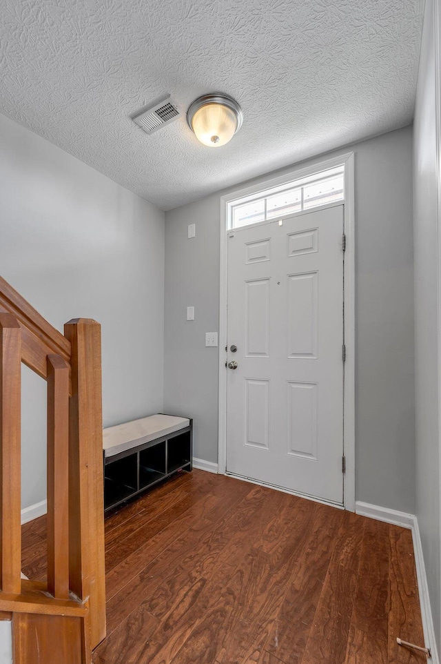 2433 Aristocracy Cir, Lexington, KY 40509 - entryway featuring wood finished floors, a textured ceiling, and baseboards