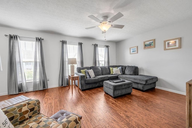 2433 Aristocracy Cir, Lexington, KY 40509 - living area featuring wood finished floors, a textured ceiling, a ceiling fan, and baseboards