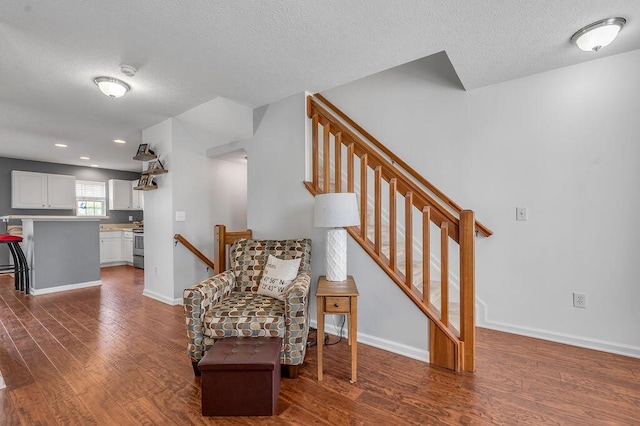 2433 Aristocracy Cir, Lexington, KY 40509 - sitting room with dark wood-type flooring, a textured ceiling, baseboards, and recessed lighting