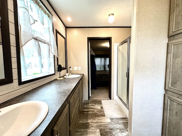 1126 College Hill Rd, Waco, KY 40385 - full bath with wood finished floors, a stall shower, double vanity, crown molding, and ensuite bath