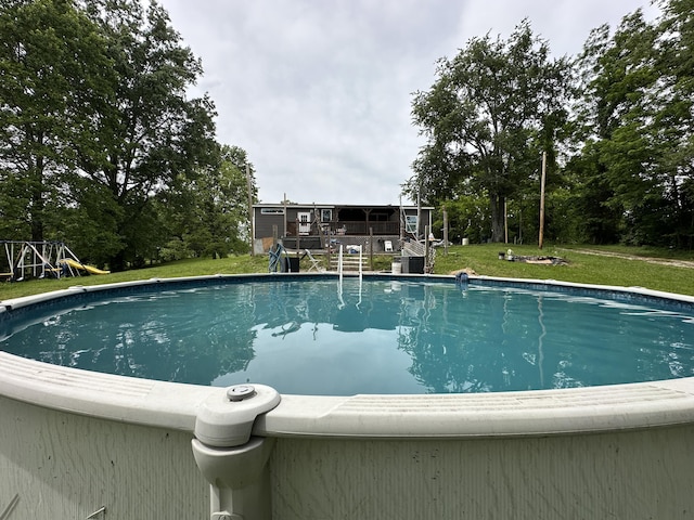 1126 College Hill Rd, Waco, KY 40385 - outdoor pool featuring a lawn and view of scattered trees