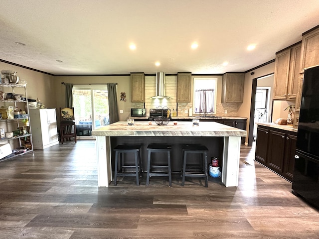 1126 College Hill Rd, Waco, KY 40385 - kitchen featuring wall chimney range hood, ornamental molding, light countertops, a center island, and backsplash
