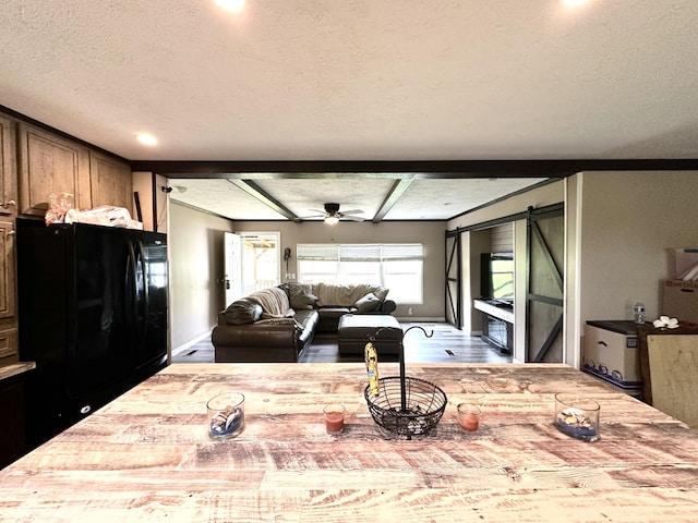 1126 College Hill Rd, Waco, KY 40385 - dining space with a textured ceiling, a barn door, recessed lighting, baseboards, and wood finished floors