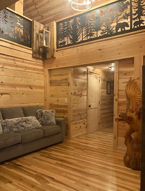 616 Zag Rd, West Liberty, KY 41472 - living area featuring wood walls, wood finished floors, and wooden ceiling