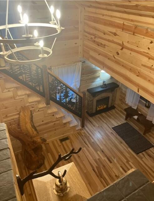 616 Zag Rd, West Liberty, KY 41472 - interior space featuring a chandelier, wood walls, and wood finished floors