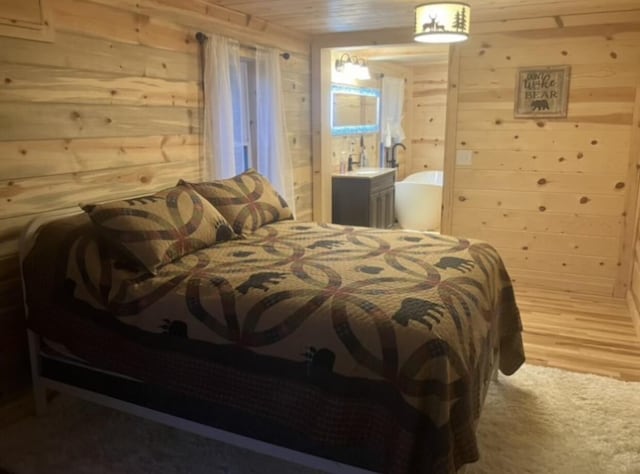 616 Zag Rd, West Liberty, KY 41472 - bedroom featuring wood walls, ensuite bath, and wood finished floors