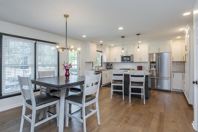 1025 Stowbridge Ln, Lexington, KY 40515 - dining room with dark wood finished floors, a chandelier, and recessed lighting
