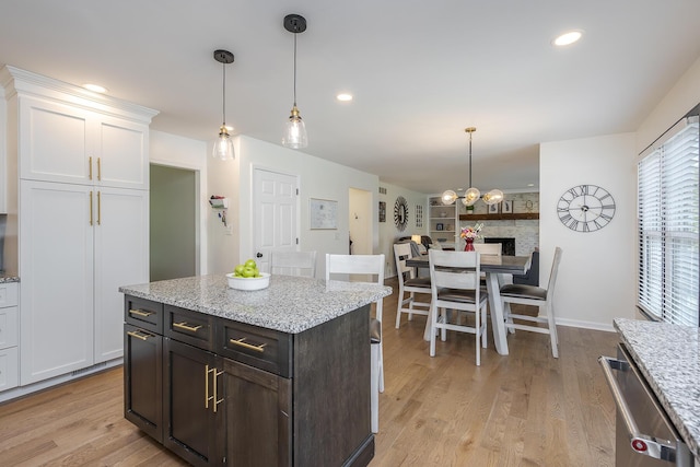 1025 Stowbridge Ln, Lexington, KY 40515 - kitchen featuring white cabinets, dishwasher, light wood-style floors, pendant lighting, and recessed lighting