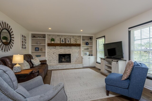 1025 Stowbridge Ln, Lexington, KY 40515 - living room featuring plenty of natural light, dark wood-style flooring, a fireplace, recessed lighting, and built in shelves