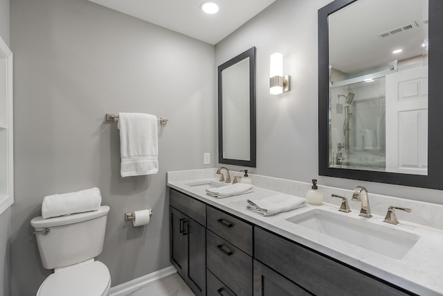 1025 Stowbridge Ln, Lexington, KY 40515 - bathroom with double vanity, a shower stall, toilet, baseboards, and recessed lighting