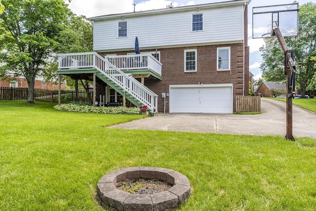 1025 Stowbridge Ln, Lexington, KY 40515 - back of house featuring a garage, brick siding, stairs, a wooden deck, and concrete driveway