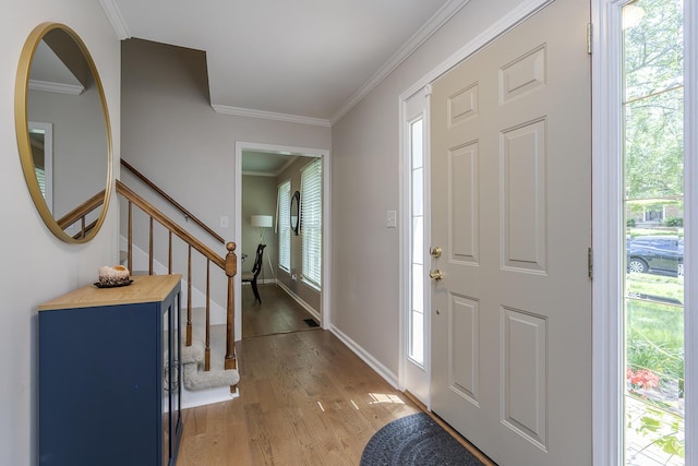 1025 Stowbridge Ln, Lexington, KY 40515 - entryway featuring crown molding, light wood finished floors, stairway, and baseboards