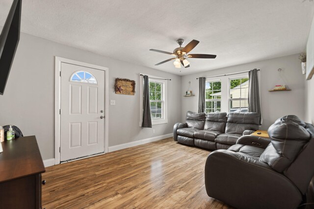 304 Hamilton Ave, Somerset, KY 42501 - living area with light wood-style flooring, a ceiling fan, and baseboards