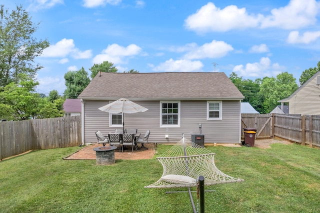304 Hamilton Ave, Somerset, KY 42501 - back of property with a fire pit, roof with shingles, and central AC