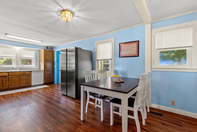 10165 Clifton Rd, Versailles, KY 40383 - dining room featuring dark wood finished floors, baseboards, and crown molding
