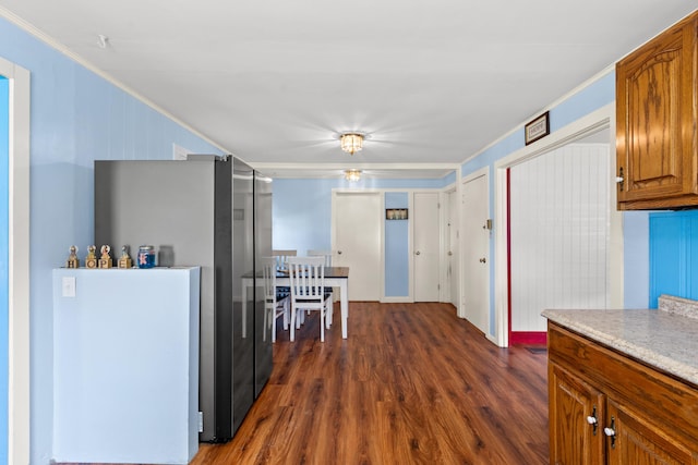 10165 Clifton Rd, Versailles, KY 40383 - kitchen with dark wood-style flooring, crown molding, brown cabinets, light countertops, and freestanding refrigerator