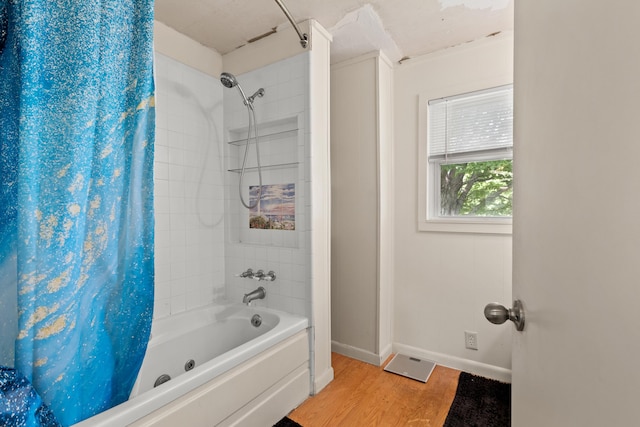 10165 Clifton Rd, Versailles, KY 40383 - full bath featuring shower / bath combination with curtain, wood finished floors, and baseboards