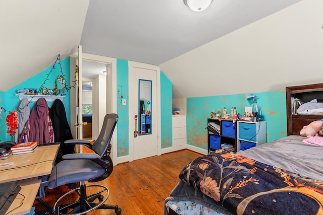 10165 Clifton Rd, Versailles, KY 40383 - bedroom featuring wood finished floors, vaulted ceiling, baseboards, and a desk