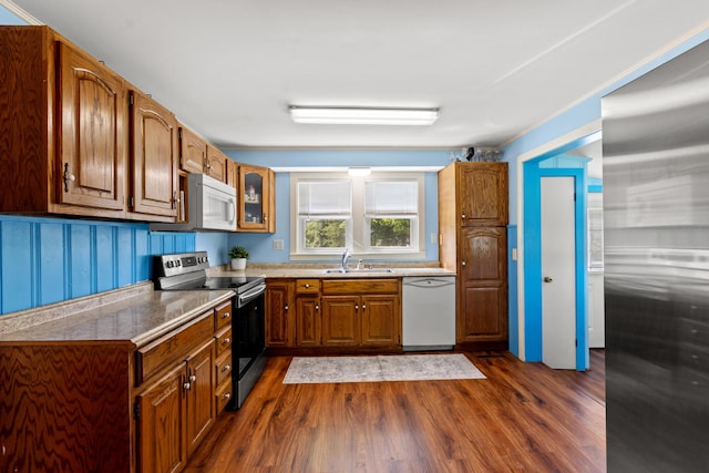 10165 Clifton Rd, Versailles, KY 40383 - kitchen featuring appliances with stainless steel finishes, dark wood-style flooring, brown cabinets, and glass insert cabinets