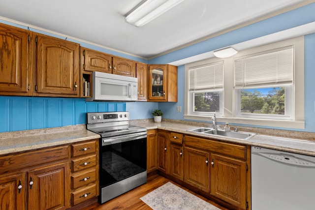 10165 Clifton Rd, Versailles, KY 40383 - kitchen with white appliances, a sink, brown cabinetry, and light countertops