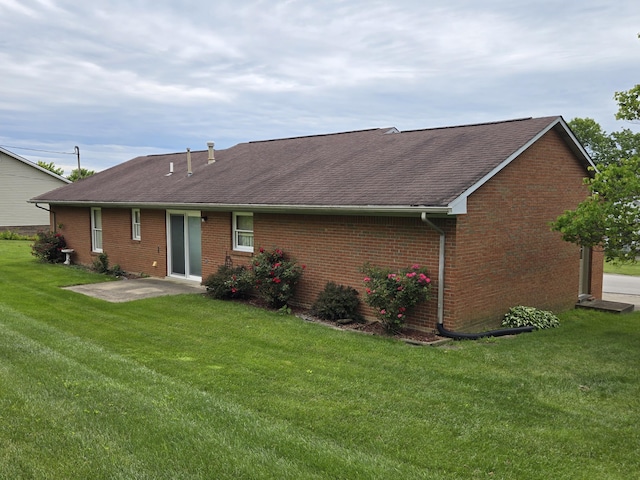 110 Albany Ln, Winchester, KY 40391 - back of house featuring a patio, a lawn, roof with shingles, and brick siding