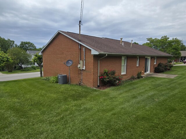 110 Albany Ln, Winchester, KY 40391 - view of side of property with brick siding, a lawn, roof with shingles, and cooling unit