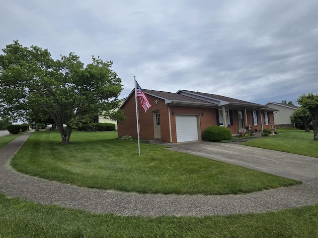 110 Albany Ln, Winchester, KY 40391 - view of front of house with a garage, a front yard, concrete driveway, and brick siding