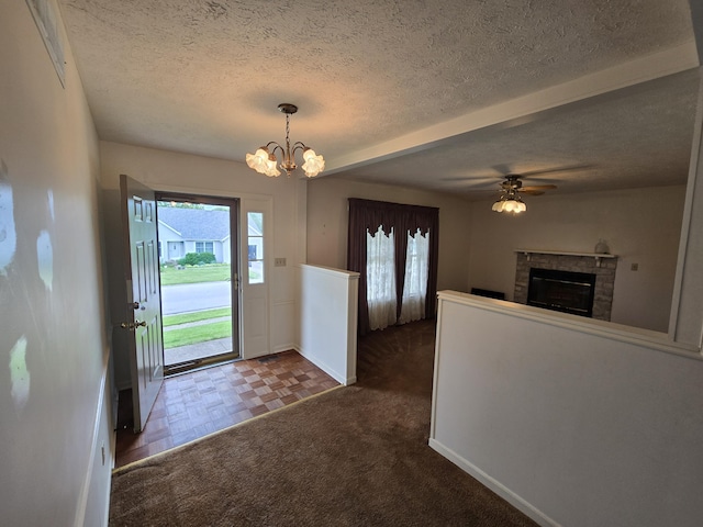 110 Albany Ln, Winchester, KY 40391 - foyer entrance with plenty of natural light, a chandelier, a fireplace, a textured ceiling, and baseboards