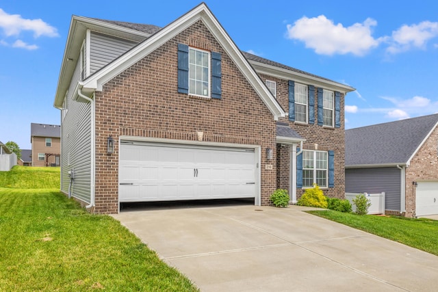 216 Blackthorn Dr, Nicholasville, KY 40356 - traditional-style home featuring brick siding, driveway, an attached garage, and a front yard