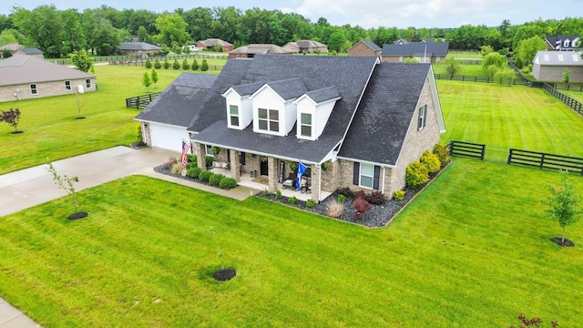 2002 Emerald Way, Richmond, KY 40475 - view of front of house with stone siding, covered porch, a garage, driveway, and roof with shingles