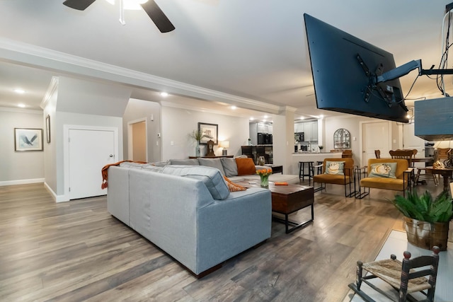 2002 Emerald Way, Richmond, KY 40475 - living area featuring crown molding, ceiling fan, wood finished floors, decorative columns, and baseboards