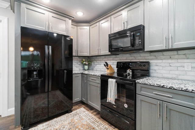 2002 Emerald Way, Richmond, KY 40475 - kitchen with black appliances, gray cabinetry, backsplash, wood finished floors, and light stone countertops