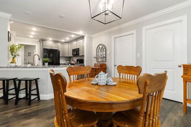 2002 Emerald Way, Richmond, KY 40475 - dining room with dark wood-style flooring, recessed lighting, crown molding, and a chandelier
