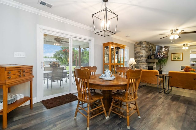 2002 Emerald Way, Richmond, KY 40475 - dining space featuring a ceiling fan, ornamental molding, dark wood-style floors, a fireplace, and a chandelier