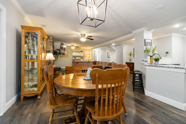 2002 Emerald Way, Richmond, KY 40475 - dining space featuring ceiling fan, dark wood-style flooring, baseboards, ornamental molding, and a chandelier