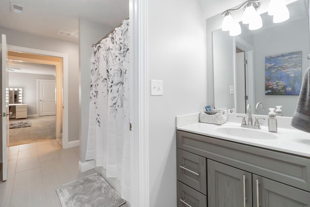 2002 Emerald Way, Richmond, KY 40475 - bathroom featuring vanity, curtained shower, and baseboards