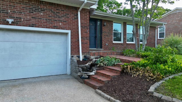 524 Cromwell Way, Lexington, KY 40503 - property entrance with an attached garage, driveway, and brick siding