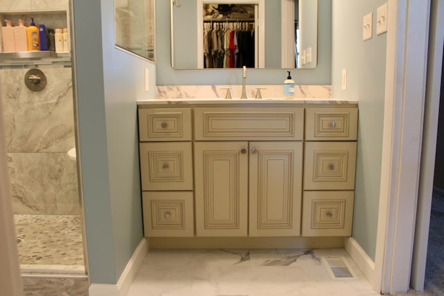 524 Cromwell Way, Lexington, KY 40503 - bathroom featuring marble look tile flooring, vanity, a marble finish shower, and baseboards