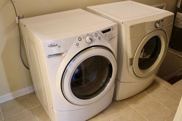 524 Cromwell Way, Lexington, KY 40503 - laundry area featuring independent washer and dryer, light tile patterned floors, and baseboards